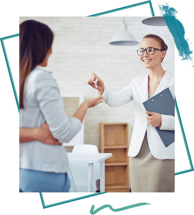 A woman handing another person keys to her.